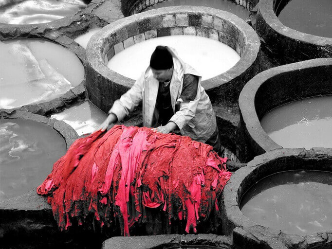 A leather artisan in the Tanneries in Fez in Morocco